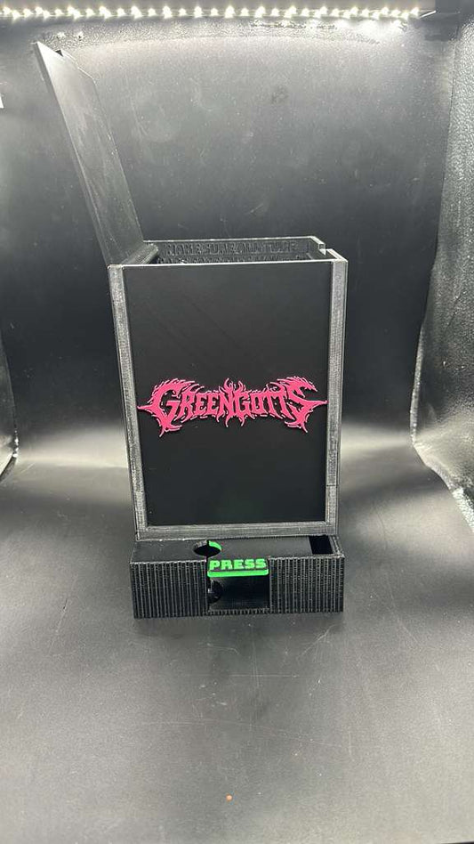 Black small tube dispenser with press button on top
